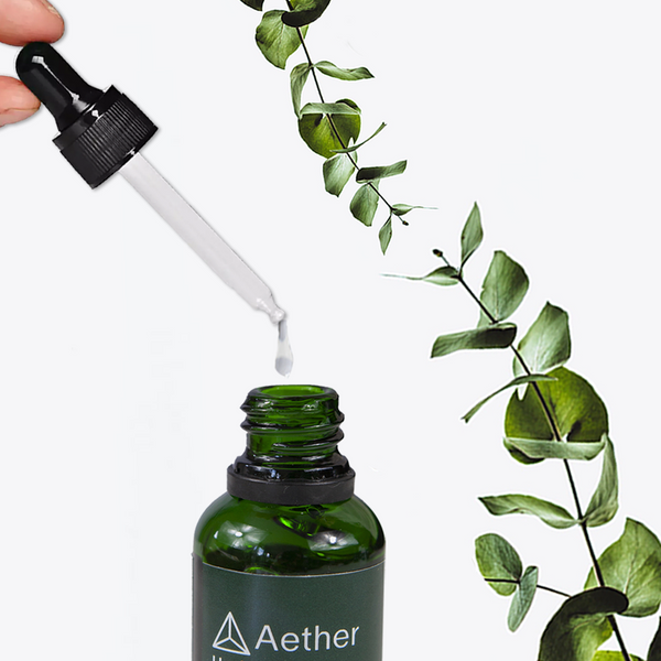 Load image into Gallery viewer, A closeup of a dropper dispensing Aether Health's Hyaluronic Acid Serum.